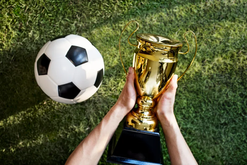 Aksi olahraga yang menggambarkan pilihan pertandingan di TOP1TOTO
